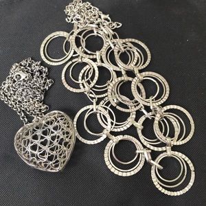 2 silver colored necklaces